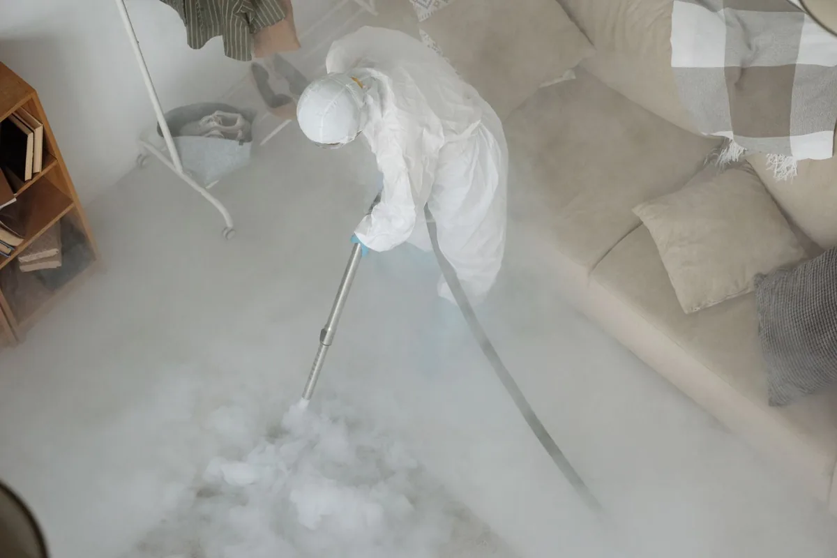 Biohazard cleanup technician in protective equipment, High Springs, FL